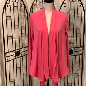 Pink polyester cardigan w/long front & short back.